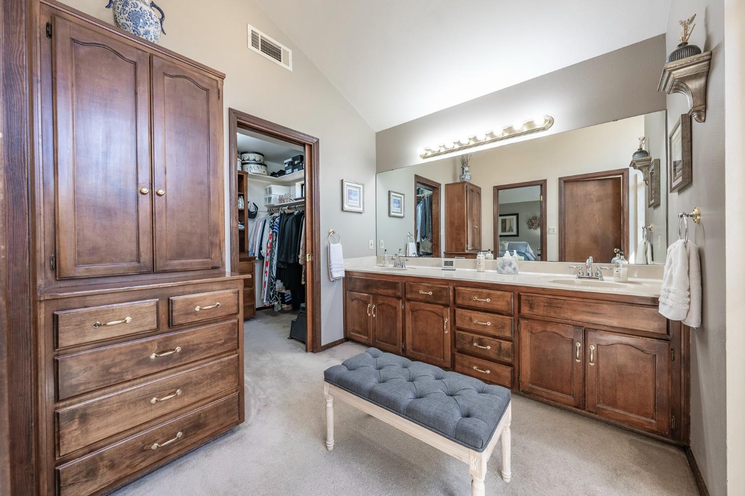 9415 21st Avenue Lemoore, CA 93245 - Photo 33 of 36 a spacious bathroom with a granite countertop sink mirror and bathtub