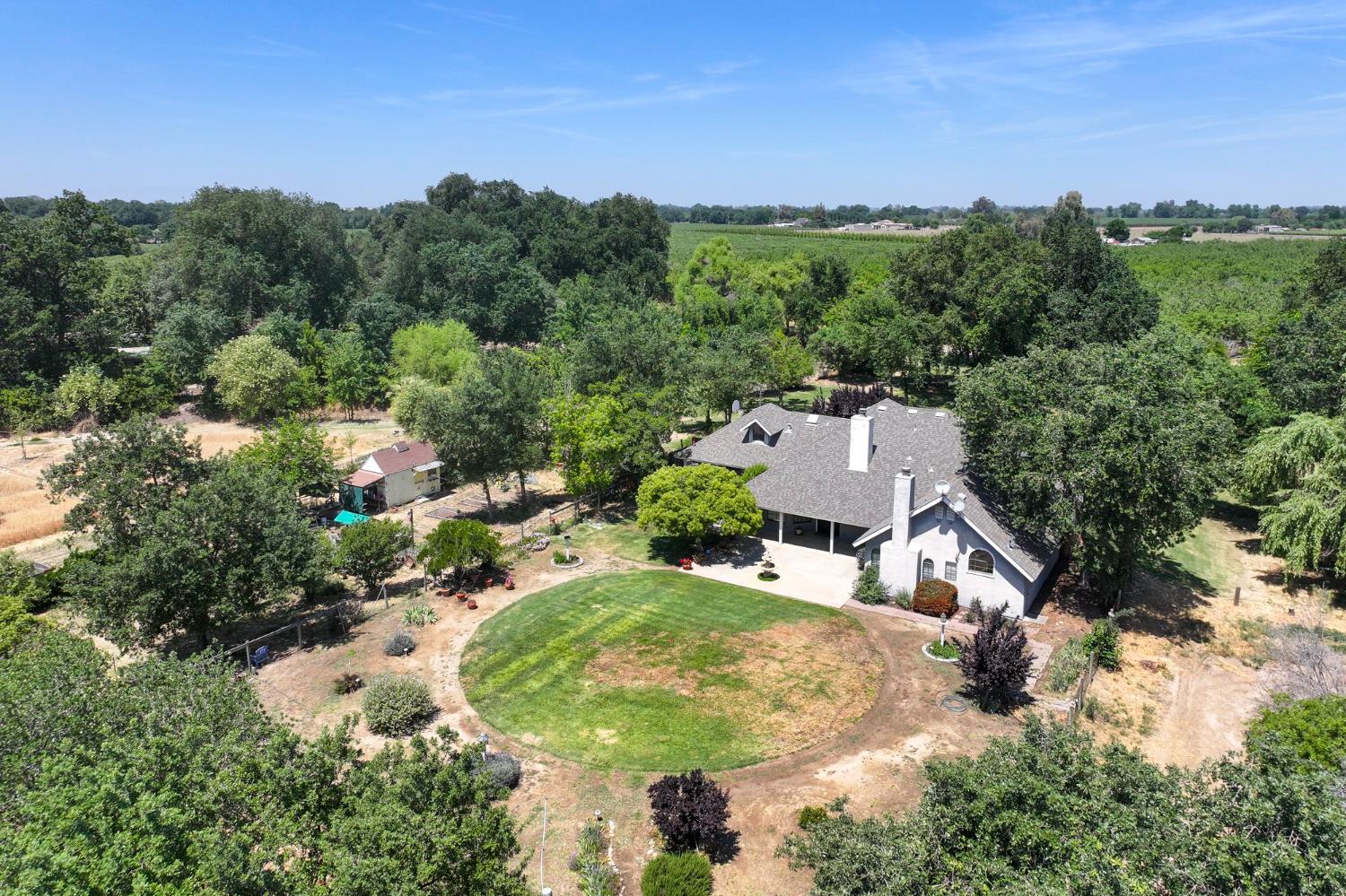 9415 21st Avenue Lemoore, CA 93245 - Photo 6 of 36 an aerial view of residential houses with outdoor space and trees