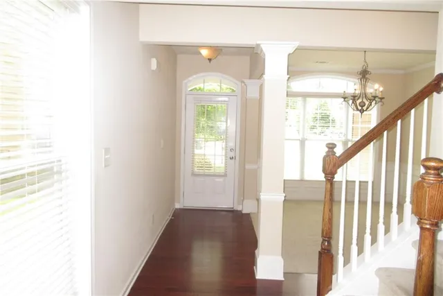 a view of entryway with wooden floor