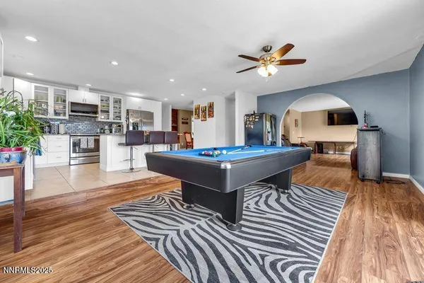 a living room with kitchen view and a couch