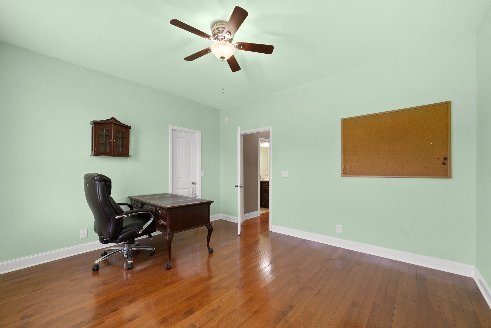 4940 Marion Road Cunningham, TN 37052 - Photo 13 of 43 a workspace with wooden floor and a ceiling fan
