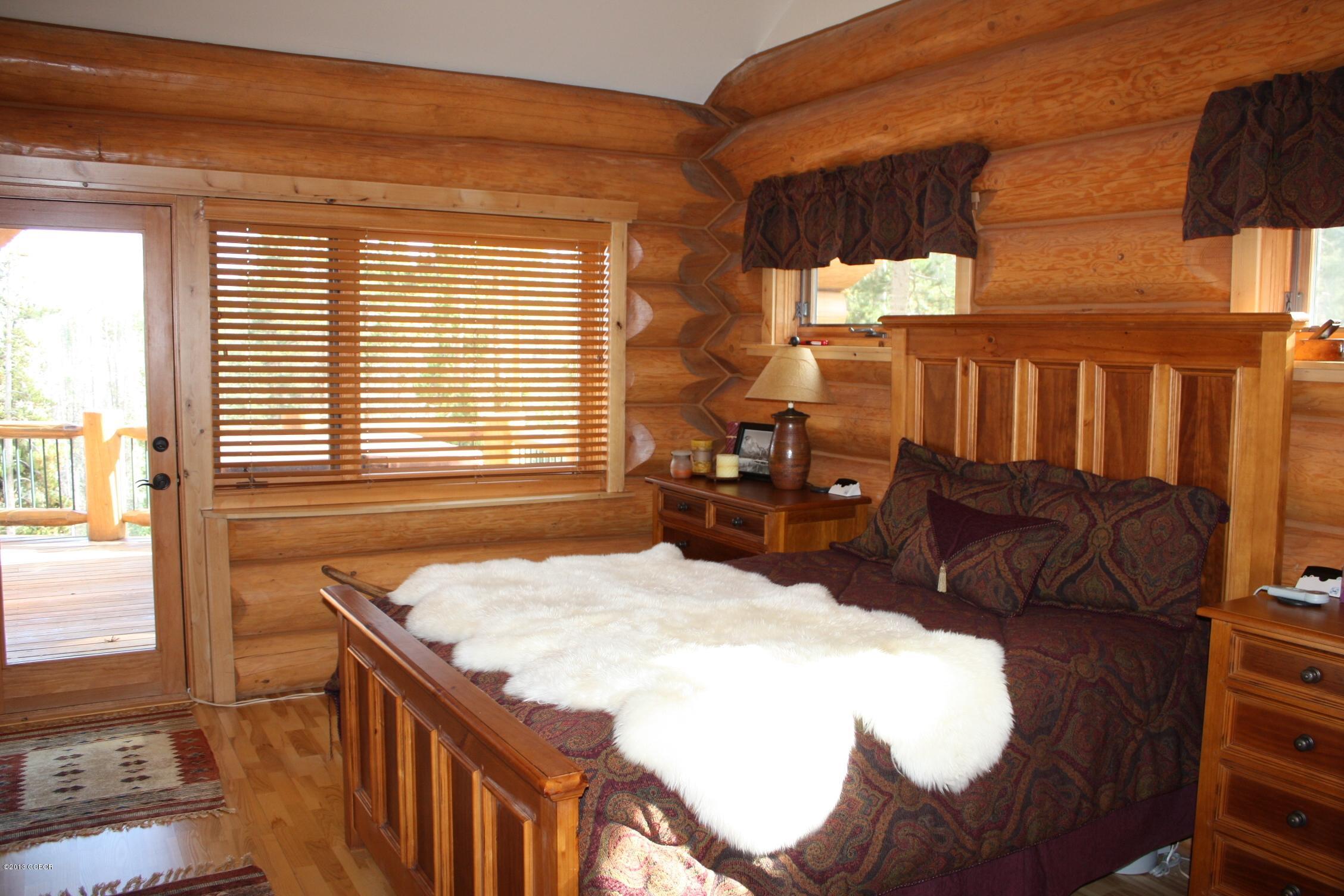 763 County Road Granby, CO 80446 - Photo 20 of 31 a bed sitting in a bedroom next to a window