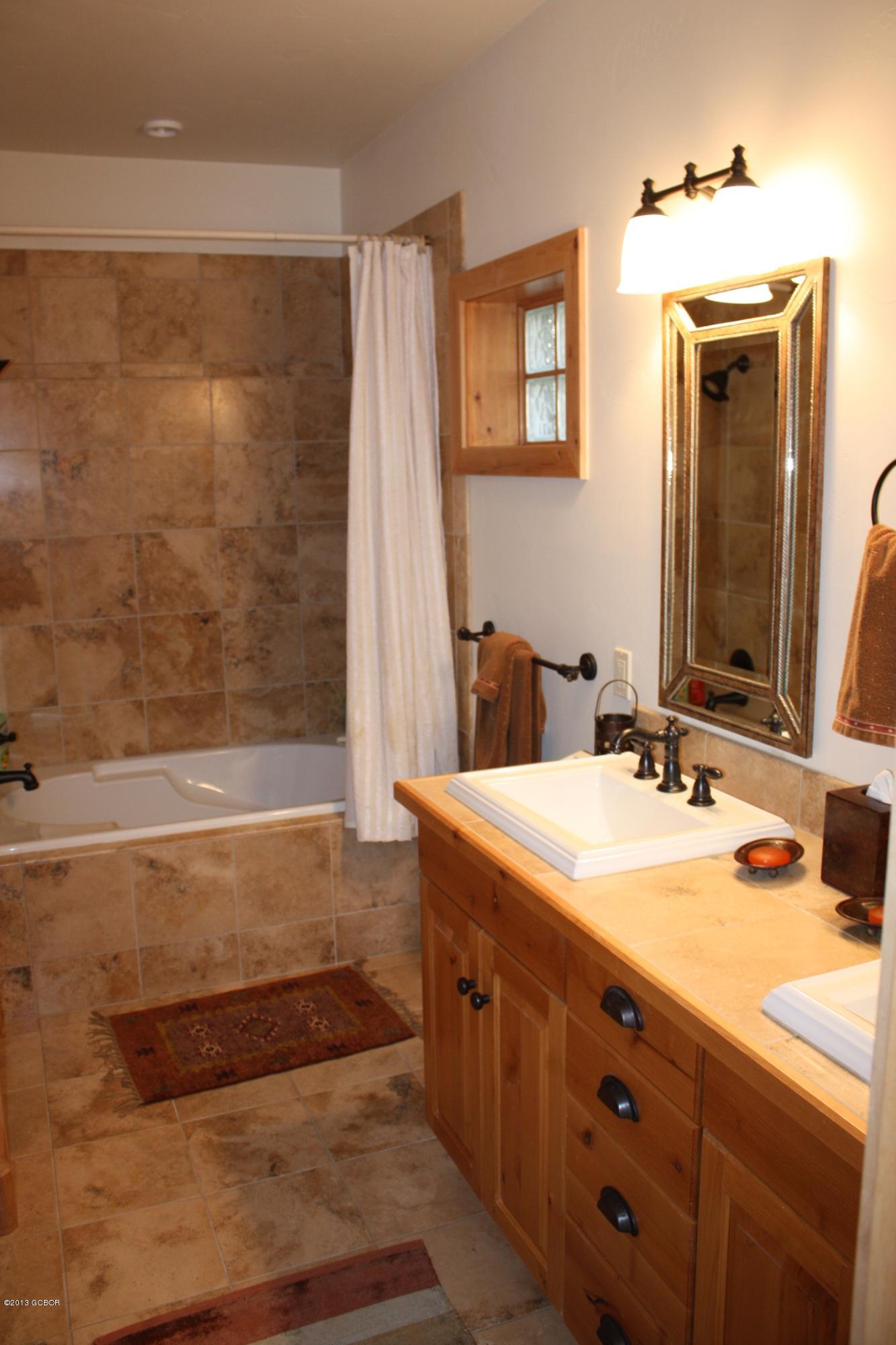 763 County Road Granby, CO 80446 - Photo 24 of 31 a bathroom with a sink and a mirror