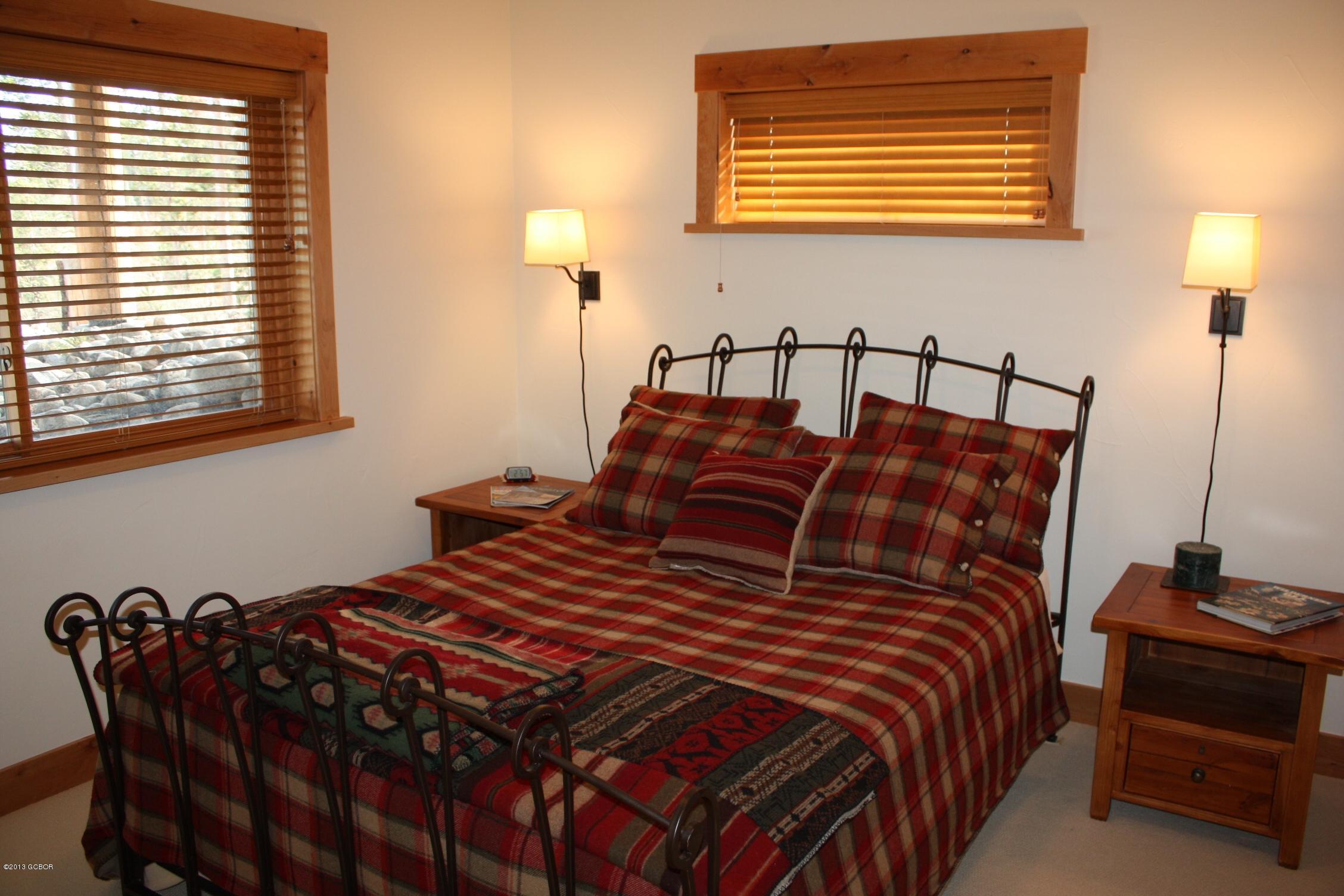 763 County Road Granby, CO 80446 - Photo 25 of 31 a bedroom with bed and two windows