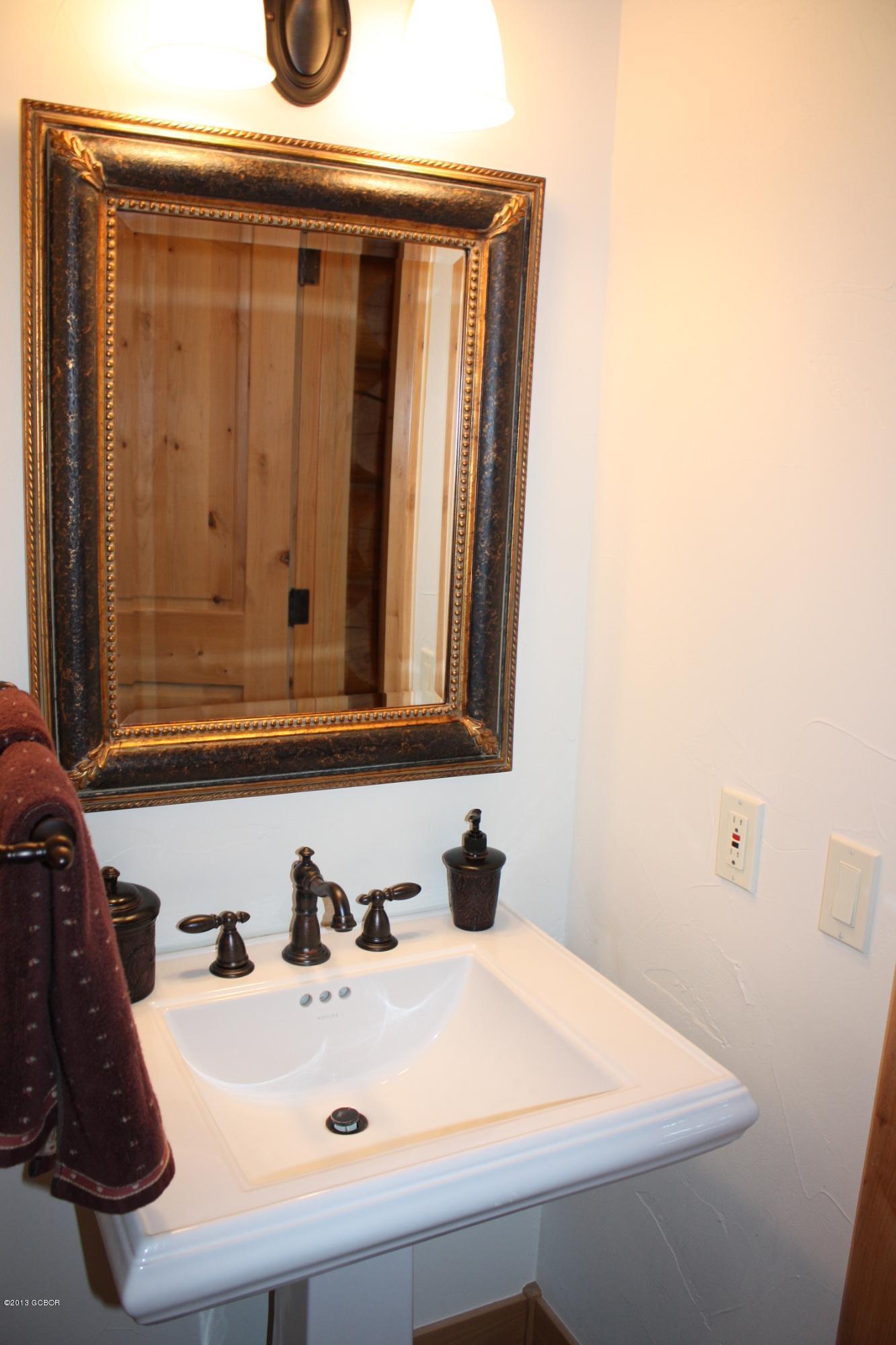 763 County Road Granby, CO 80446 - Photo 27 of 31 a bathroom with a sink and a mirror