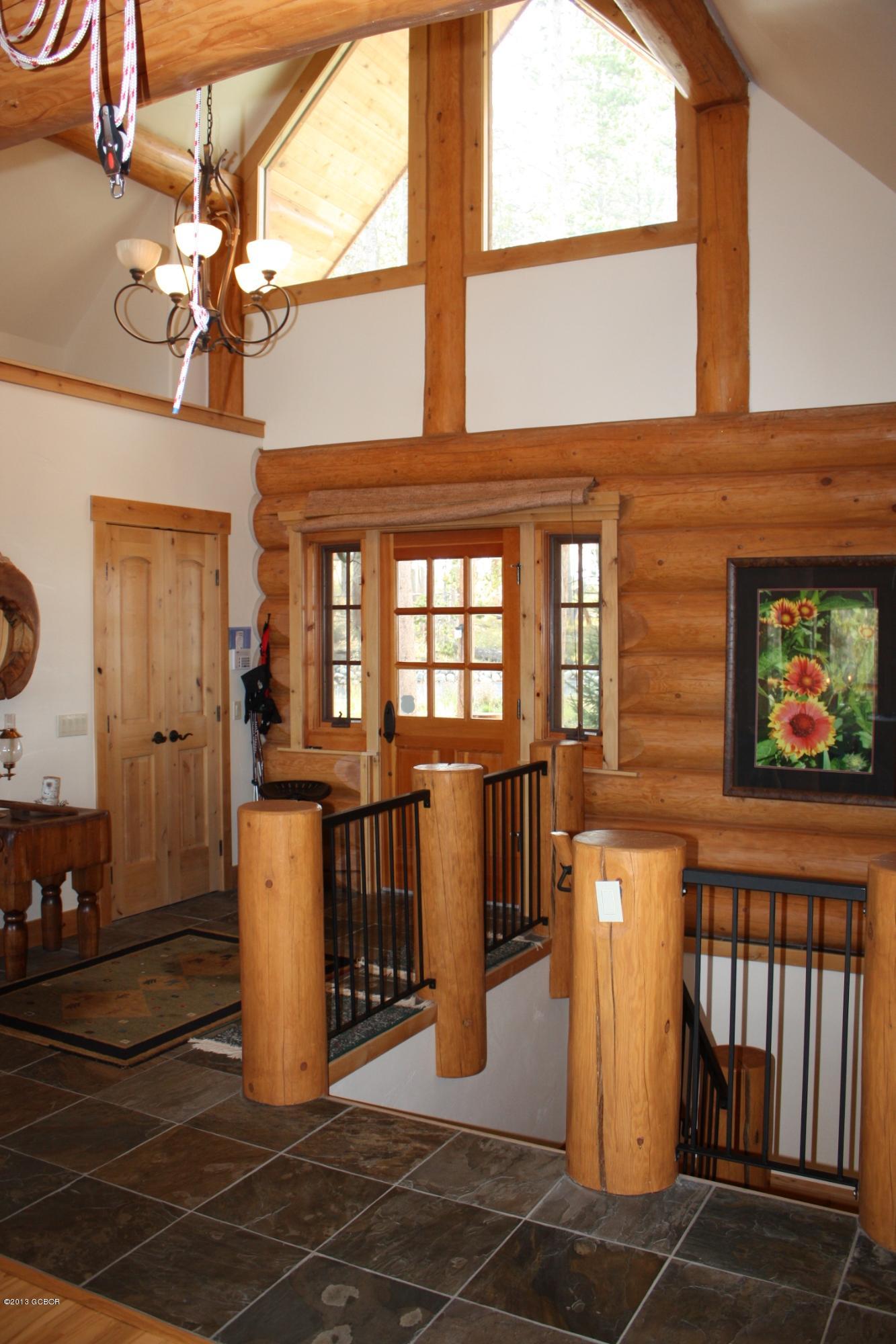 763 County Road Granby, CO 80446 - Photo 6 of 31 a view of a dining room with furniture a chandelier and wooden floor