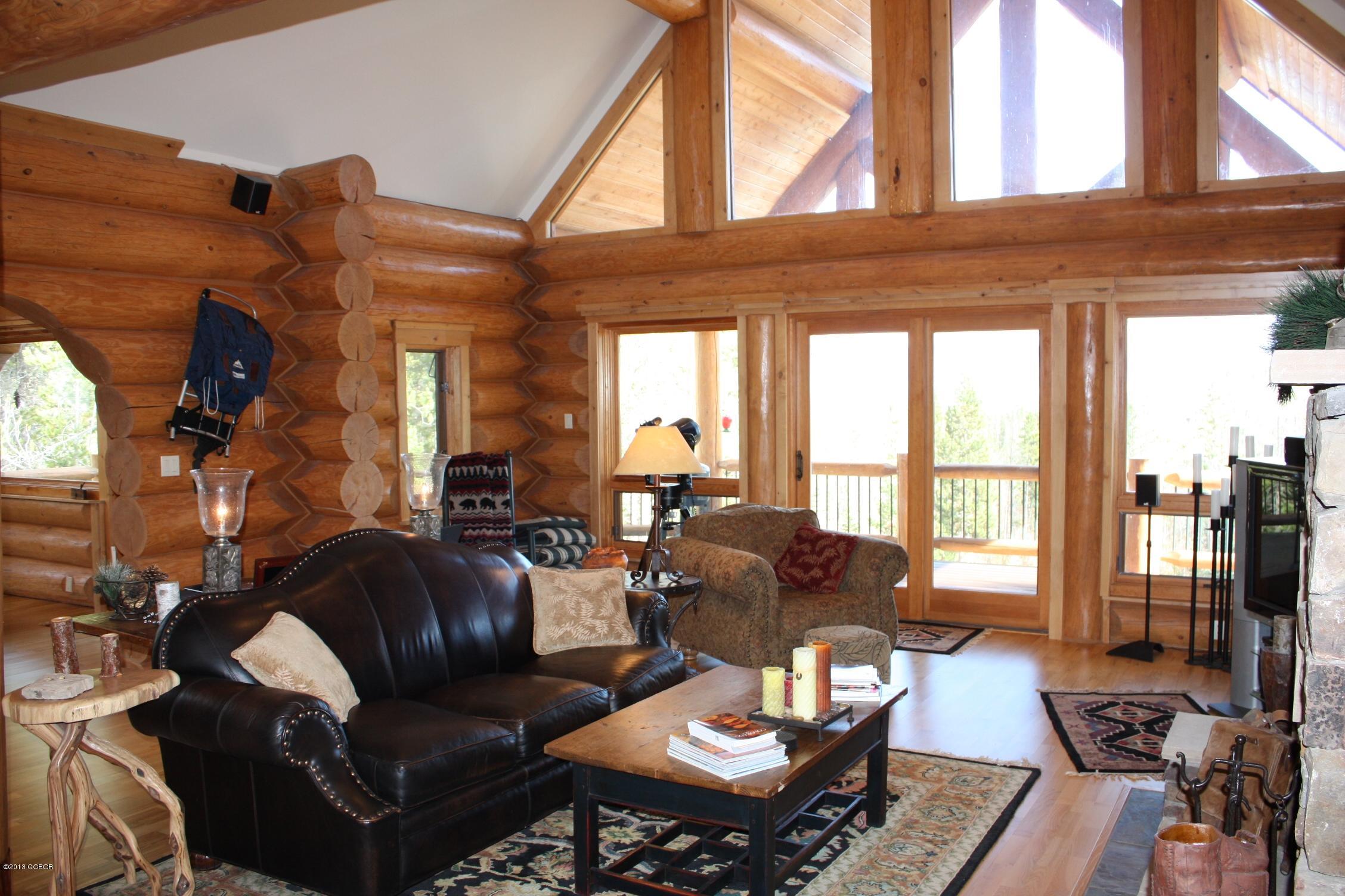 763 County Road Granby, CO 80446 - Photo 7 of 31 a living room with furniture a wooden floor and a large window