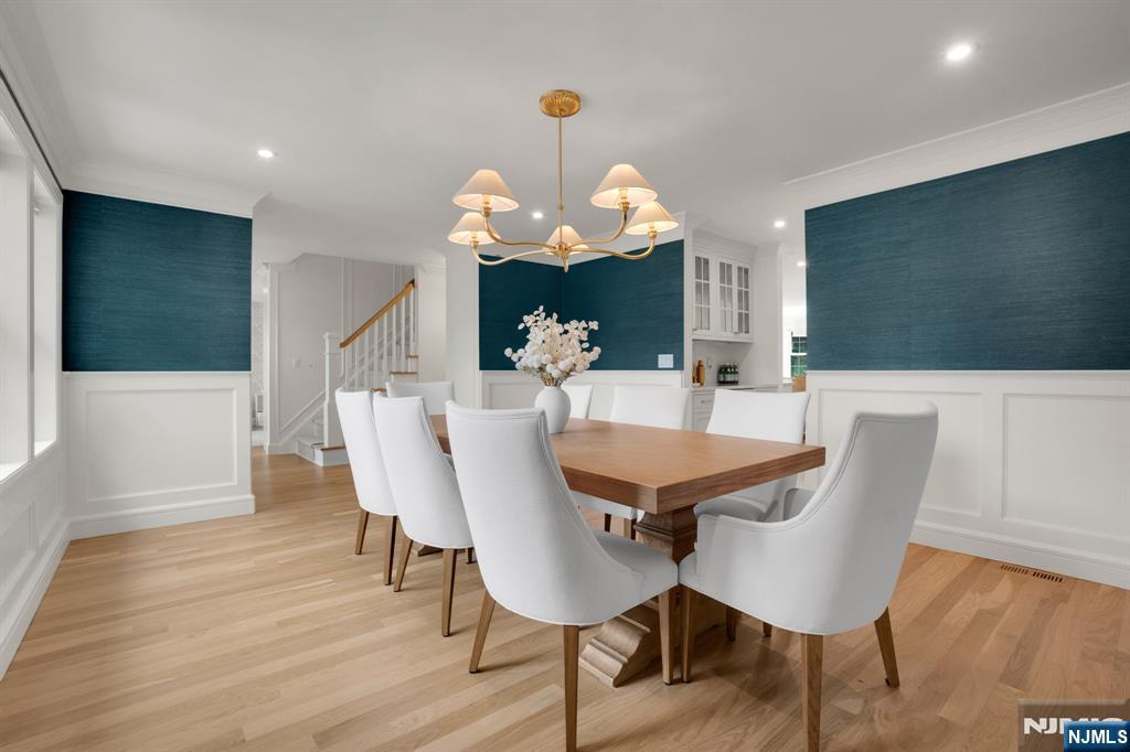 331 Wastena Terrace Ridgewood, NJ 07450 - Photo 16 of 49 a view of a dining room with furniture and wooden floor