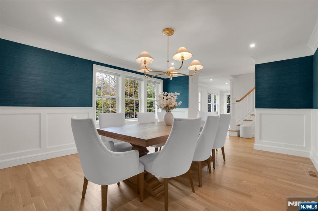 331 Wastena Terrace Ridgewood, NJ 07450 - Photo 18 of 49 a view of a dining room with furniture and wooden floor
