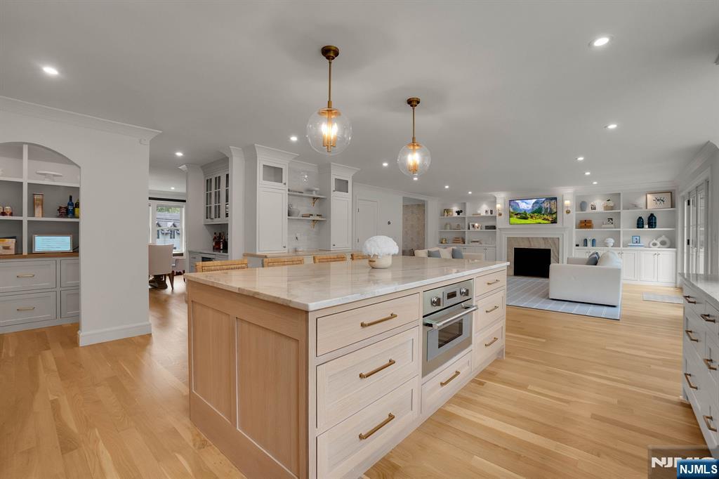 331 Wastena Terrace Ridgewood, NJ 07450 - Photo 2 of 49 a kitchen with stainless steel appliances kitchen island a large counter top a sink a stove and a refrigerator