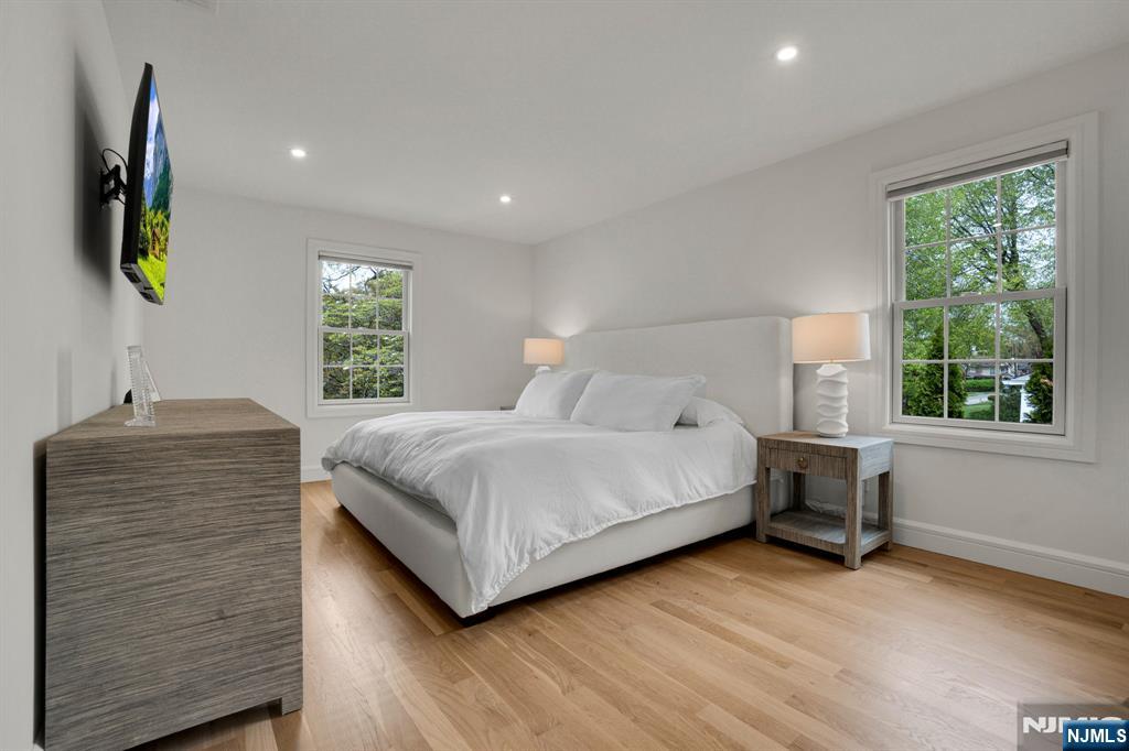 331 Wastena Terrace Ridgewood, NJ 07450 - Photo 24 of 49 a bedroom with a bed and a window