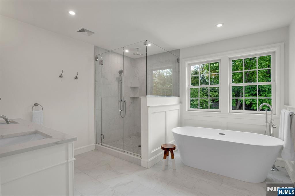 331 Wastena Terrace Ridgewood, NJ 07450 - Photo 27 of 49 a bathroom with a bathtub and a sink