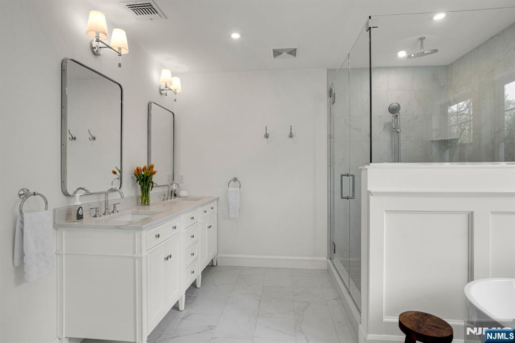 331 Wastena Terrace Ridgewood, NJ 07450 - Photo 31 of 49 a bathroom with a double vanity sink mirror and toilet