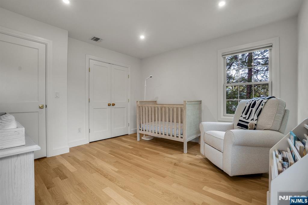 331 Wastena Terrace Ridgewood, NJ 07450 - Photo 32 of 49 a bedroom with furniture and a window