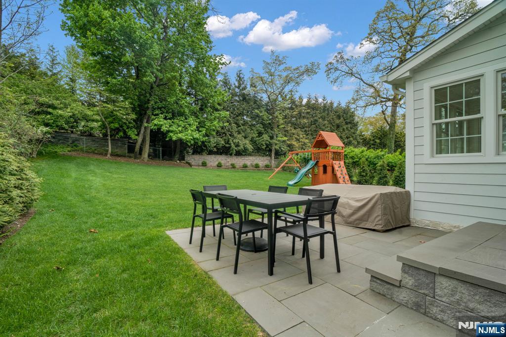 331 Wastena Terrace Ridgewood, NJ 07450 - Photo 45 of 49 a view of a tables and chairs in the patio