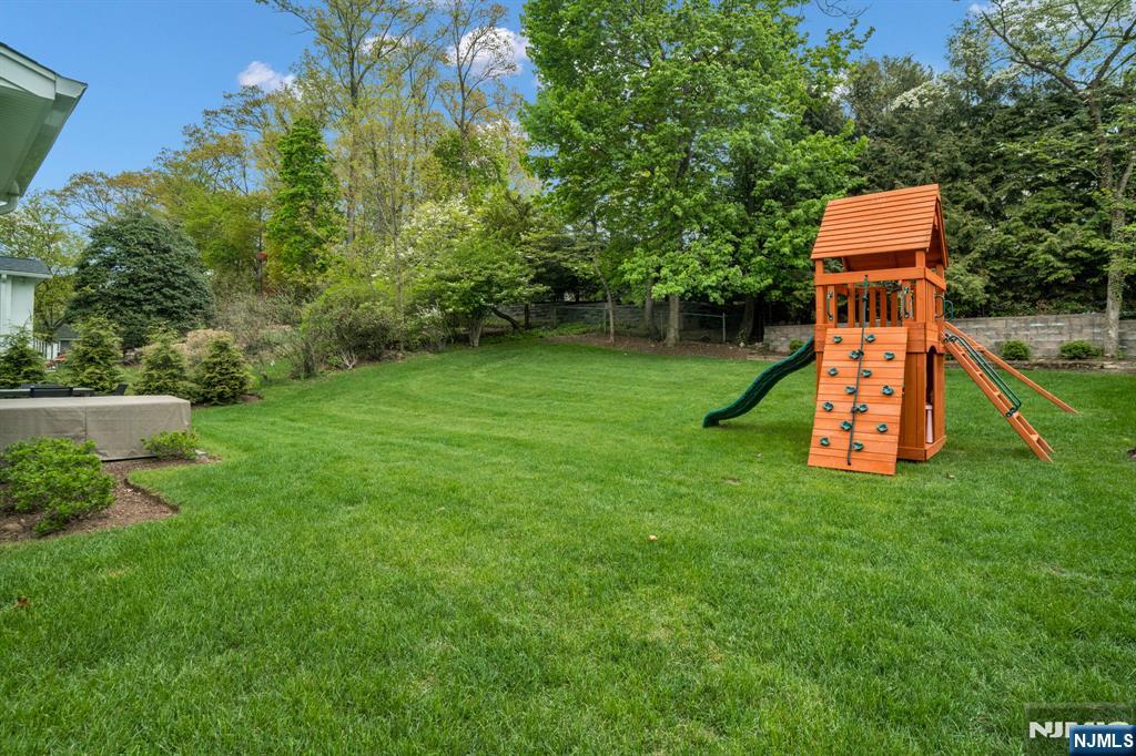 331 Wastena Terrace Ridgewood, NJ 07450 - Photo 49 of 49 a backyard of a house with lots of green space
