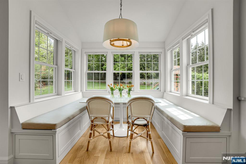 331 Wastena Terrace Ridgewood, NJ 07450 - Photo 8 of 49 a dining room with furniture and a large window