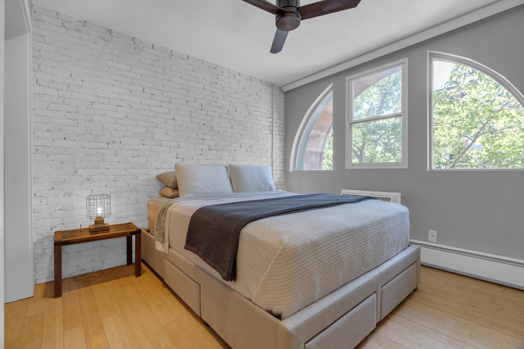 9 Appleton Street, Unit M1 Boston, MA 02116 - Photo 13 of 24 a bedroom with a bed and windows
