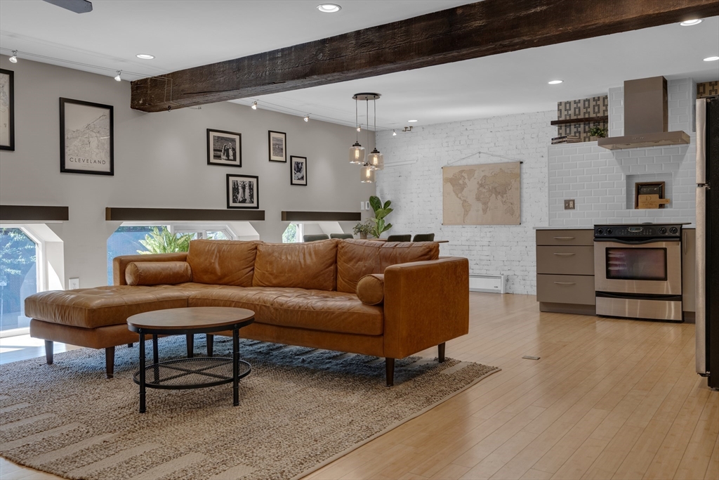 9 Appleton Street, Unit M1 Boston, MA 02116 - Photo 6 of 24 a living room with furniture and kitchen view