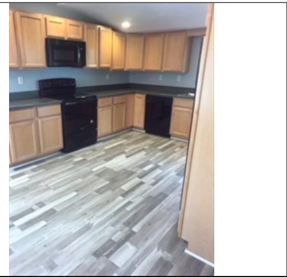 847 Washington Street, Unit 2FRONT Canton, MA 02021 - Photo 2 of 14 a kitchen with granite countertop a sink and cabinets