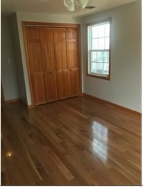 847 Washington Street, Unit 2FRONT Canton, MA 02021 - Photo 8 of 14 an empty room with wooden floor and windows
