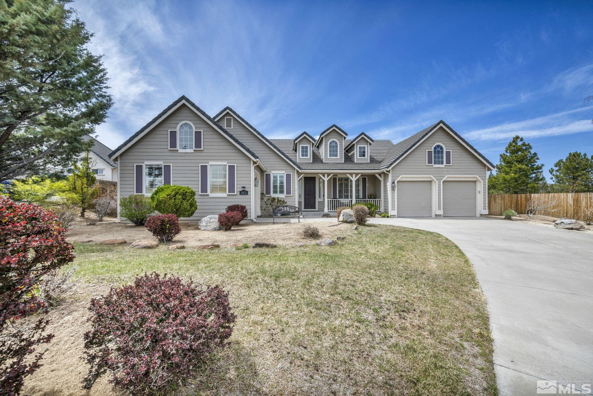 3471 Forest View Court Reno, NV 89511 - Photo 1 of 38 a front view of a house with a yard and garage