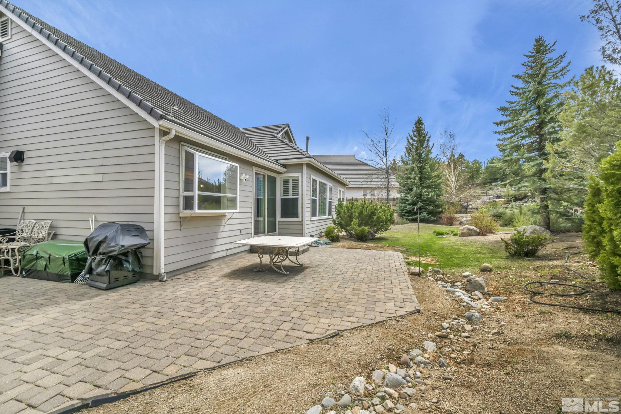 3471 Forest View Court Reno, NV 89511 - Photo 17 of 38 a view of a house with backyard and sitting area