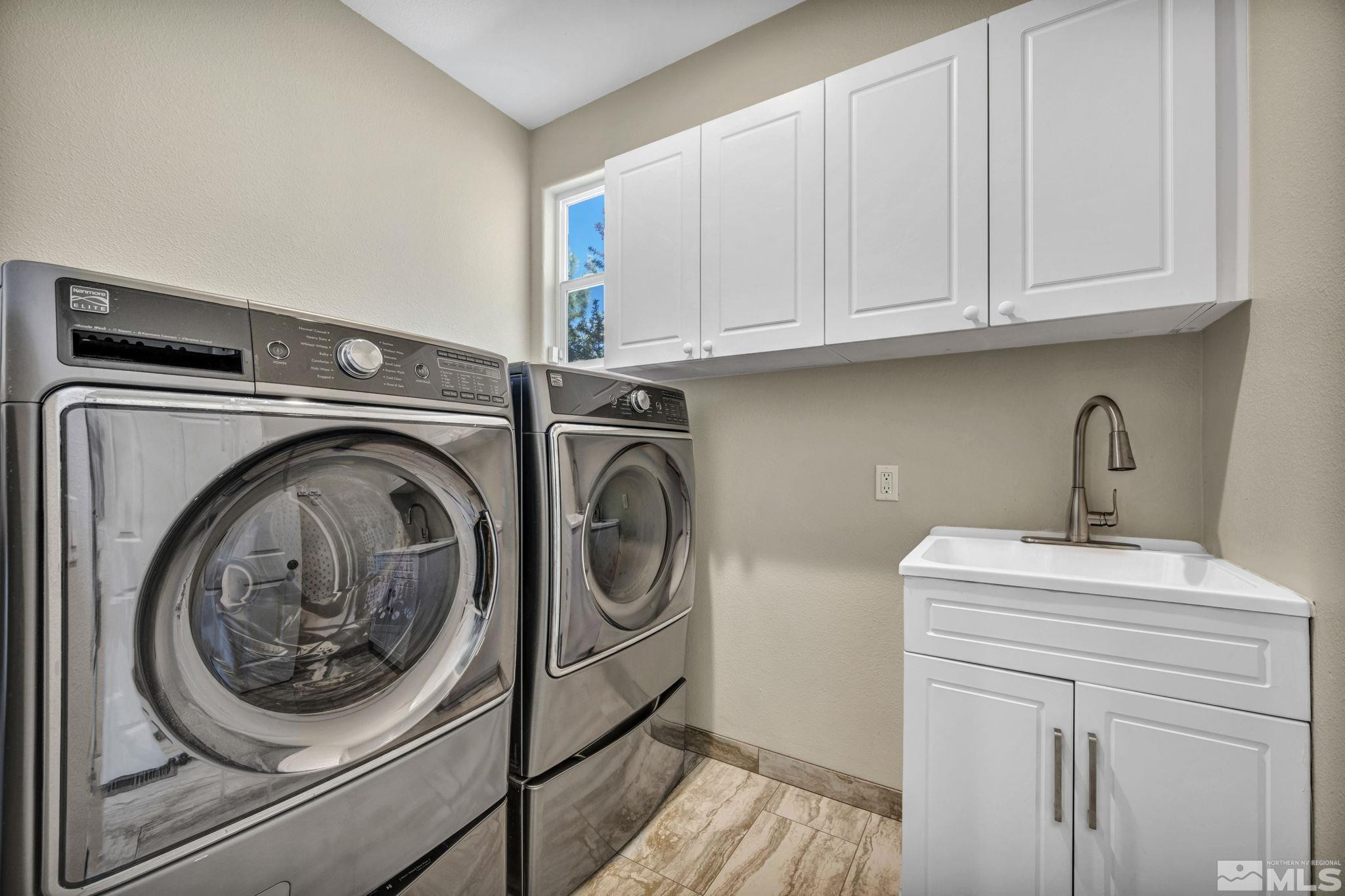 3471 Forest View Court Reno, NV 89511 - Photo 19 of 38 a utility room with sink dryer and washer