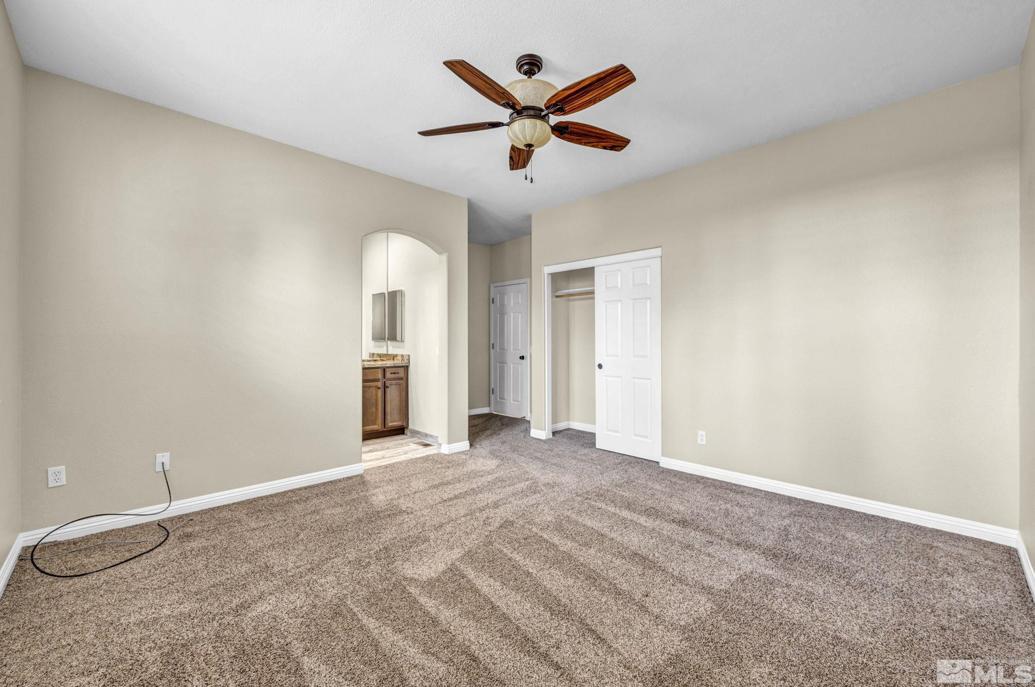 3471 Forest View Court Reno, NV 89511 - Photo 37 of 38 an empty room with closet and ceiling fan