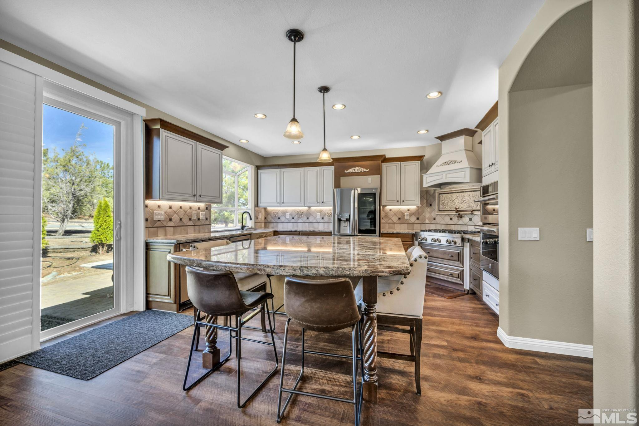 3471 Forest View Court Reno, NV 89511 - Photo 5 of 38 a view of a dining room with furniture window and wooden floor