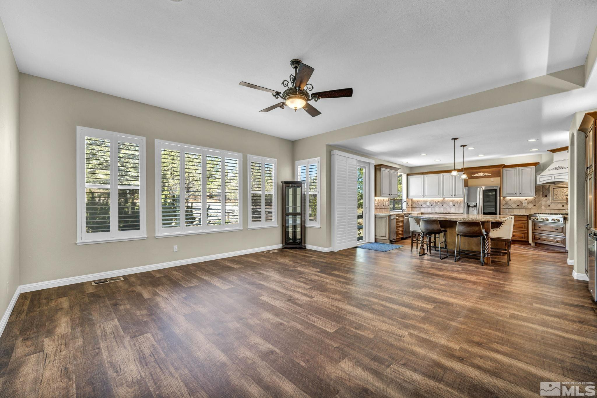 3471 Forest View Court Reno, NV 89511 - Photo 8 of 38 a view of a livingroom with furniture and a ceiling fan