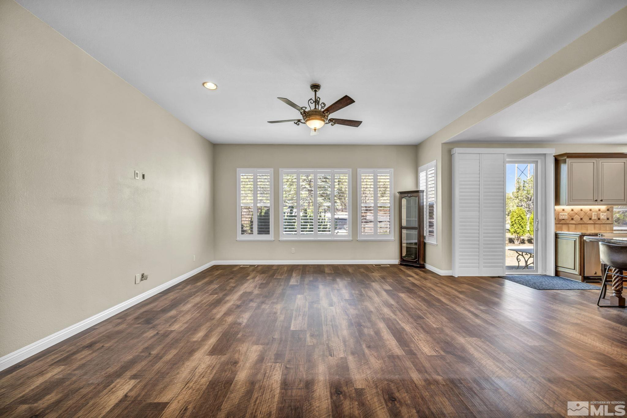 3471 Forest View Court Reno, NV 89511 - Photo 9 of 38 wooden floor in an empty room with a window