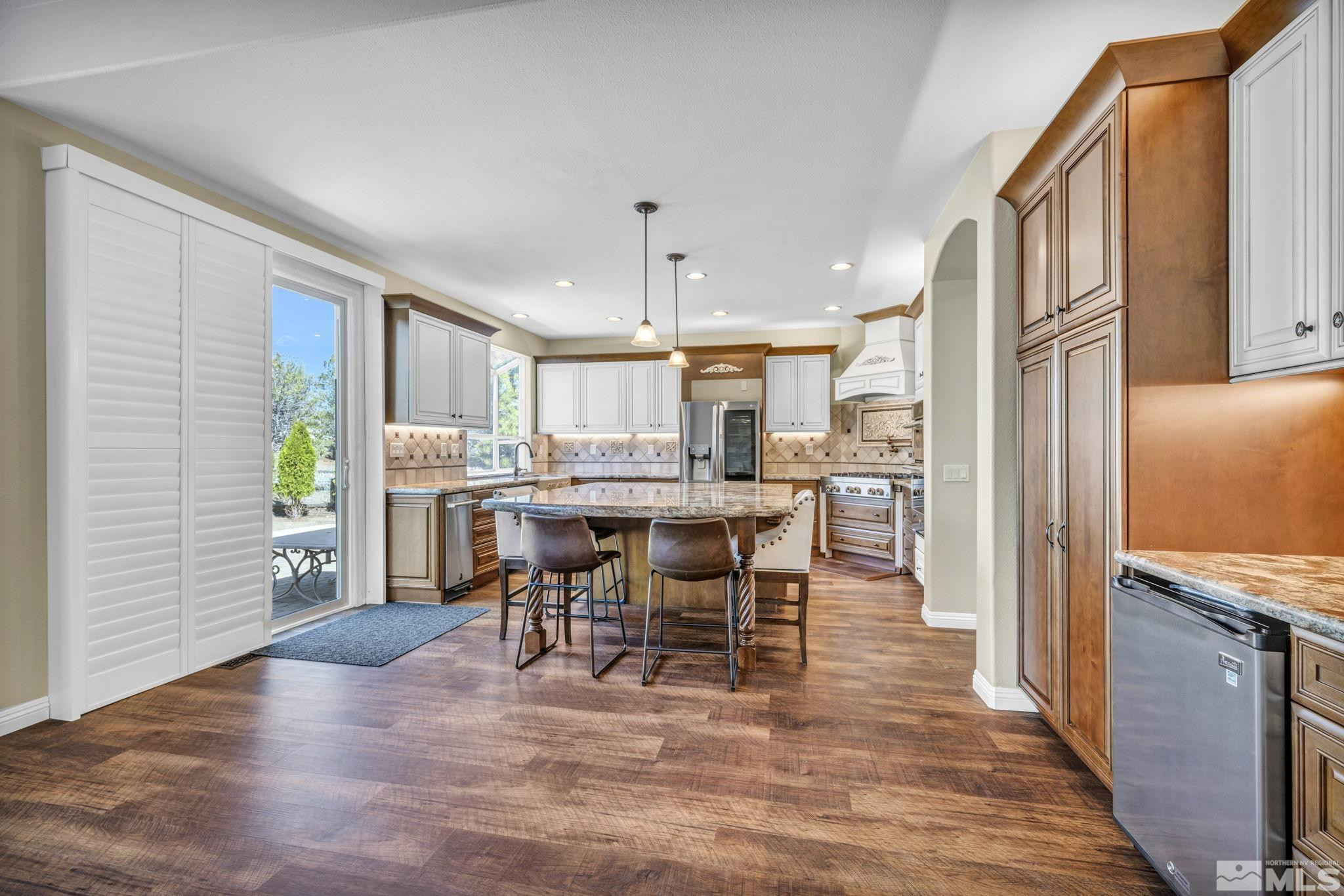 3471 Forest View Court Reno, NV 89511 - Photo 10 of 38 a view of a dining room with furniture and wooden floor