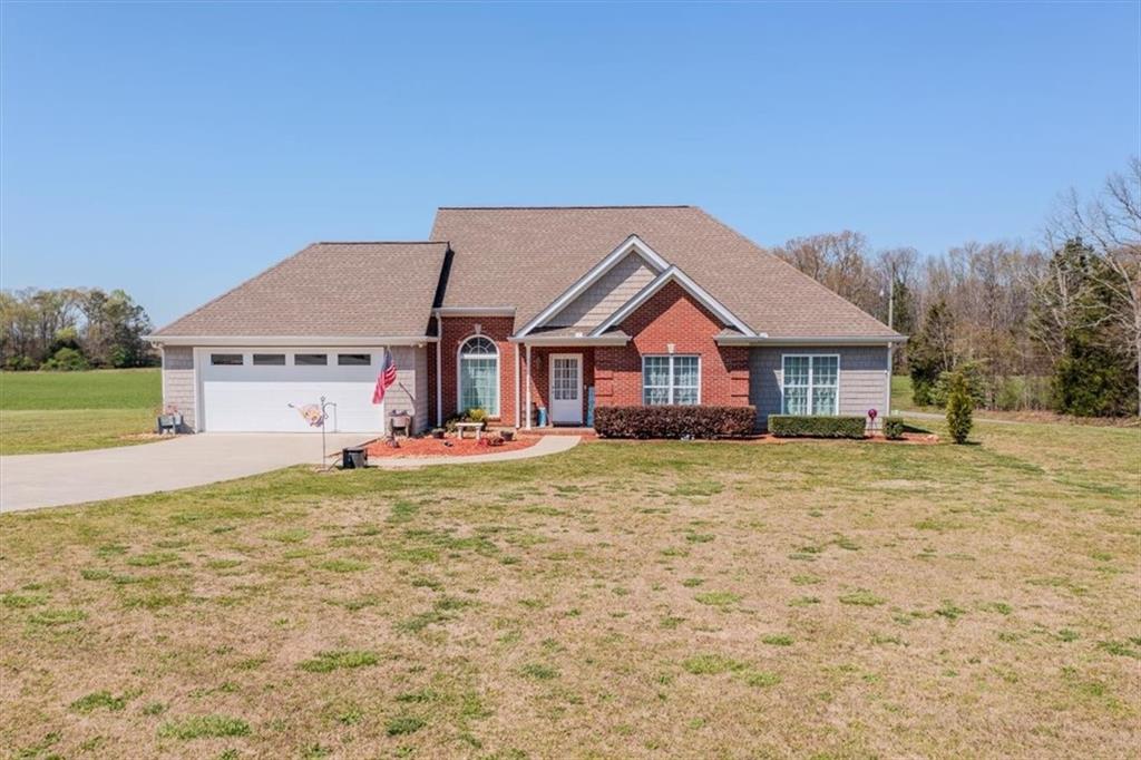 3393 Collard Valley Road Cedartown, GA 30125 - Photo 1 of 1 a front view of a house with a yard