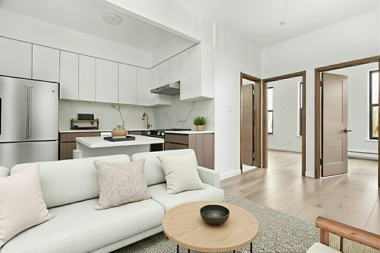 a living room with white couches and a refrigerator with wooden floor