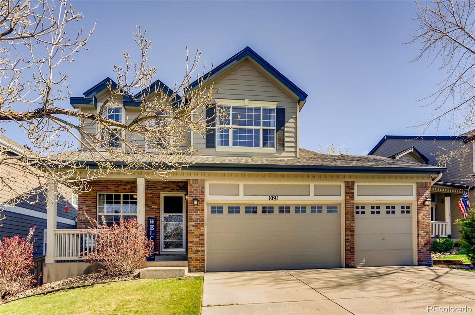 1091 Riddlewood Road Highlands Ranch, CO 80129 - Photo 1 of 26 front view of a building