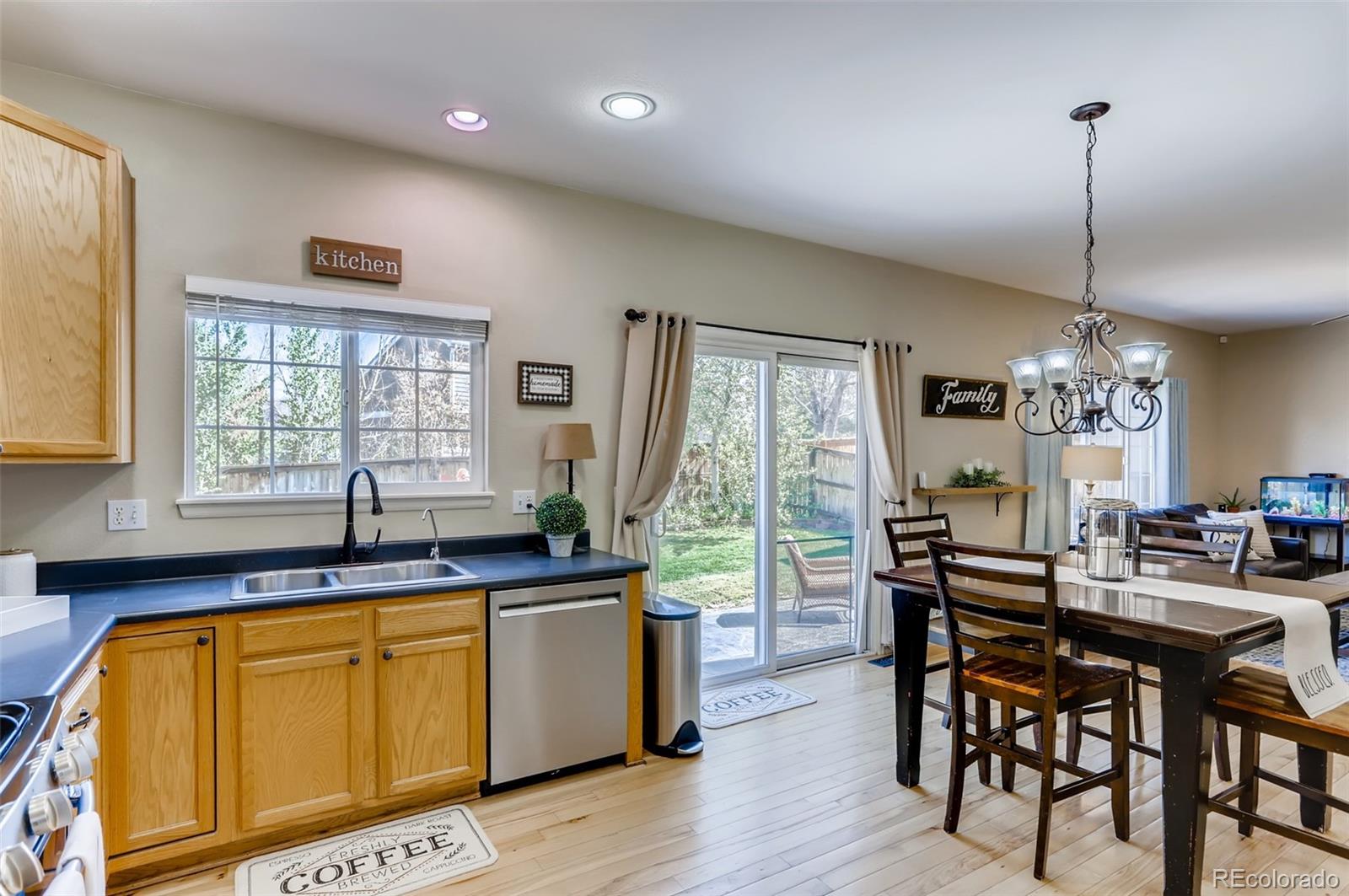 1091 Riddlewood Road Highlands Ranch, CO 80129 - Photo 7 of 26 a view of a dining room with furniture and windows