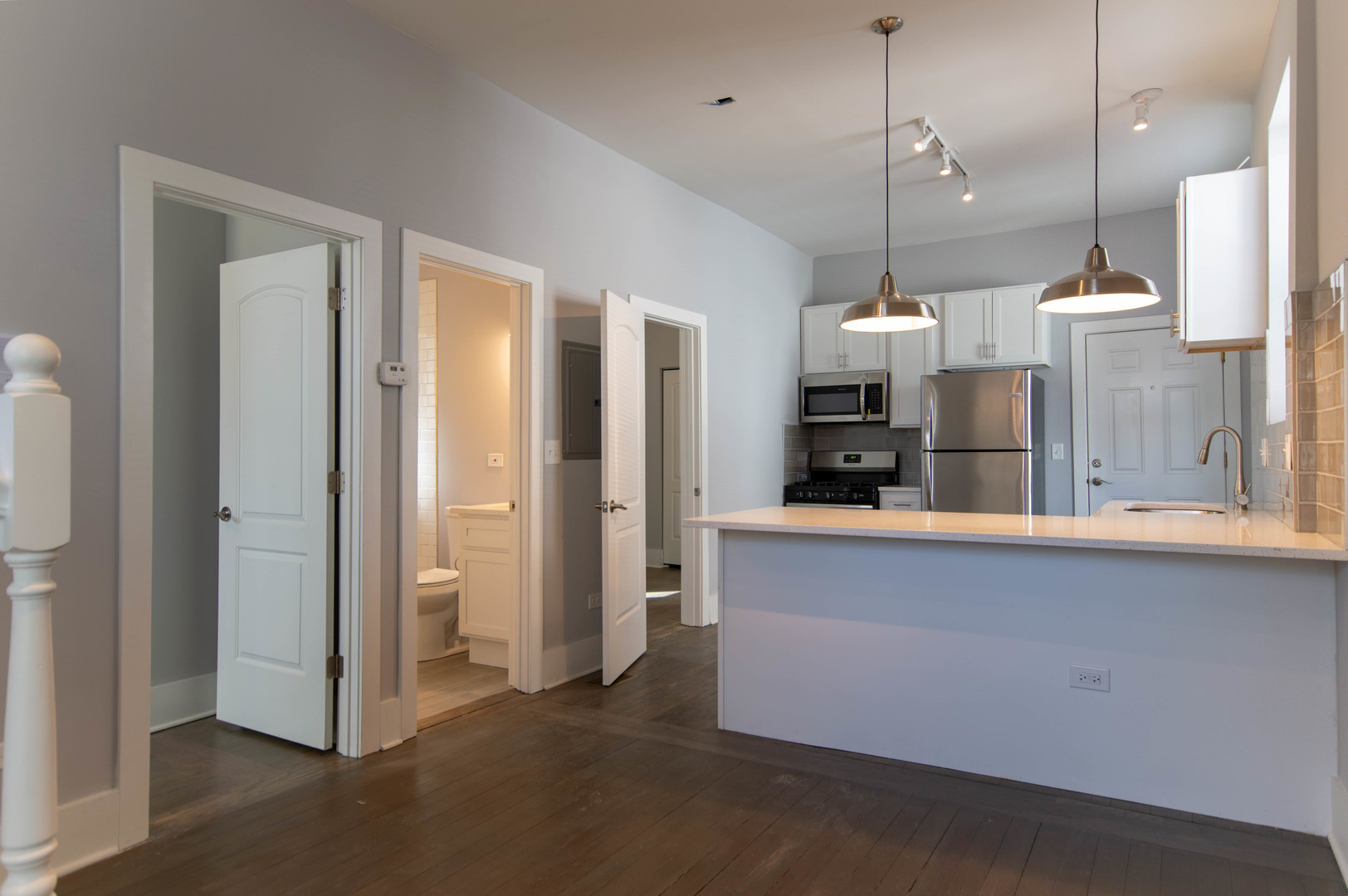 2117 West 18th Street, Unit 1R Chicago, IL 60608 - Photo 3 of 8 a open kitchen with refrigerator and microwave