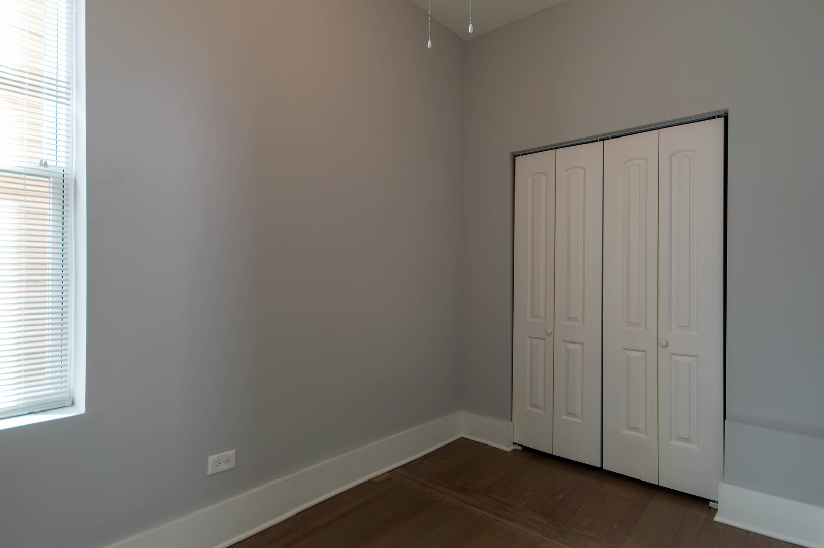 2117 West 18th Street, Unit 1R Chicago, IL 60608 - Photo 6 of 8 an empty room with a wooden door