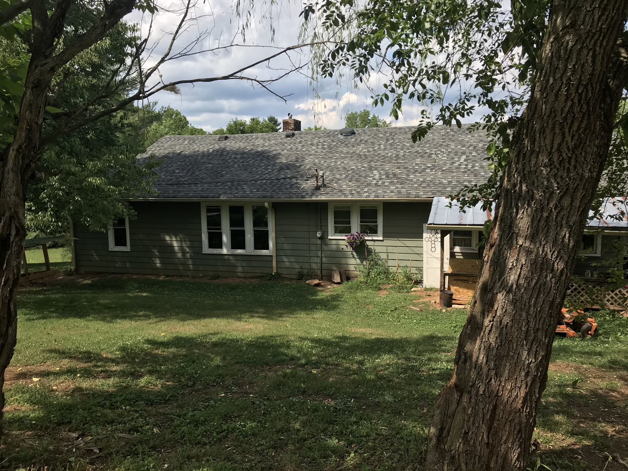 2850 Henry Gower Road Pleasant View, TN 37146 - Photo 3 of 22 a front view of a house with a garden