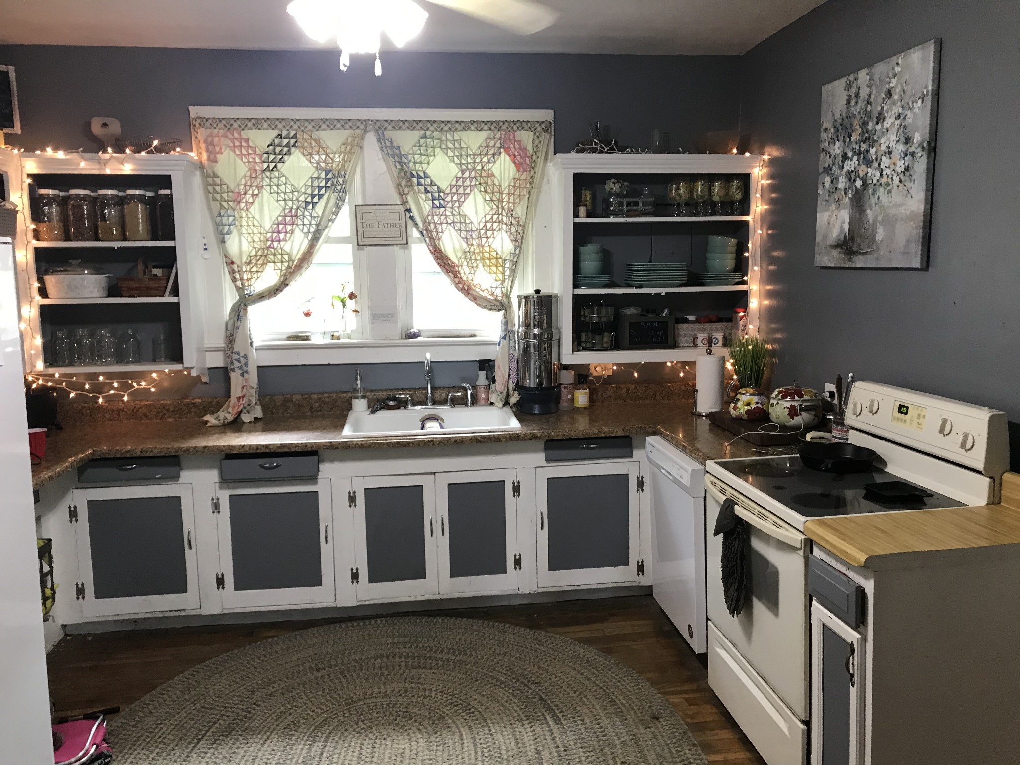 2850 Henry Gower Road Pleasant View, TN 37146 - Photo 6 of 22 a kitchen with stainless steel appliances granite countertop a stove and a white cabinets