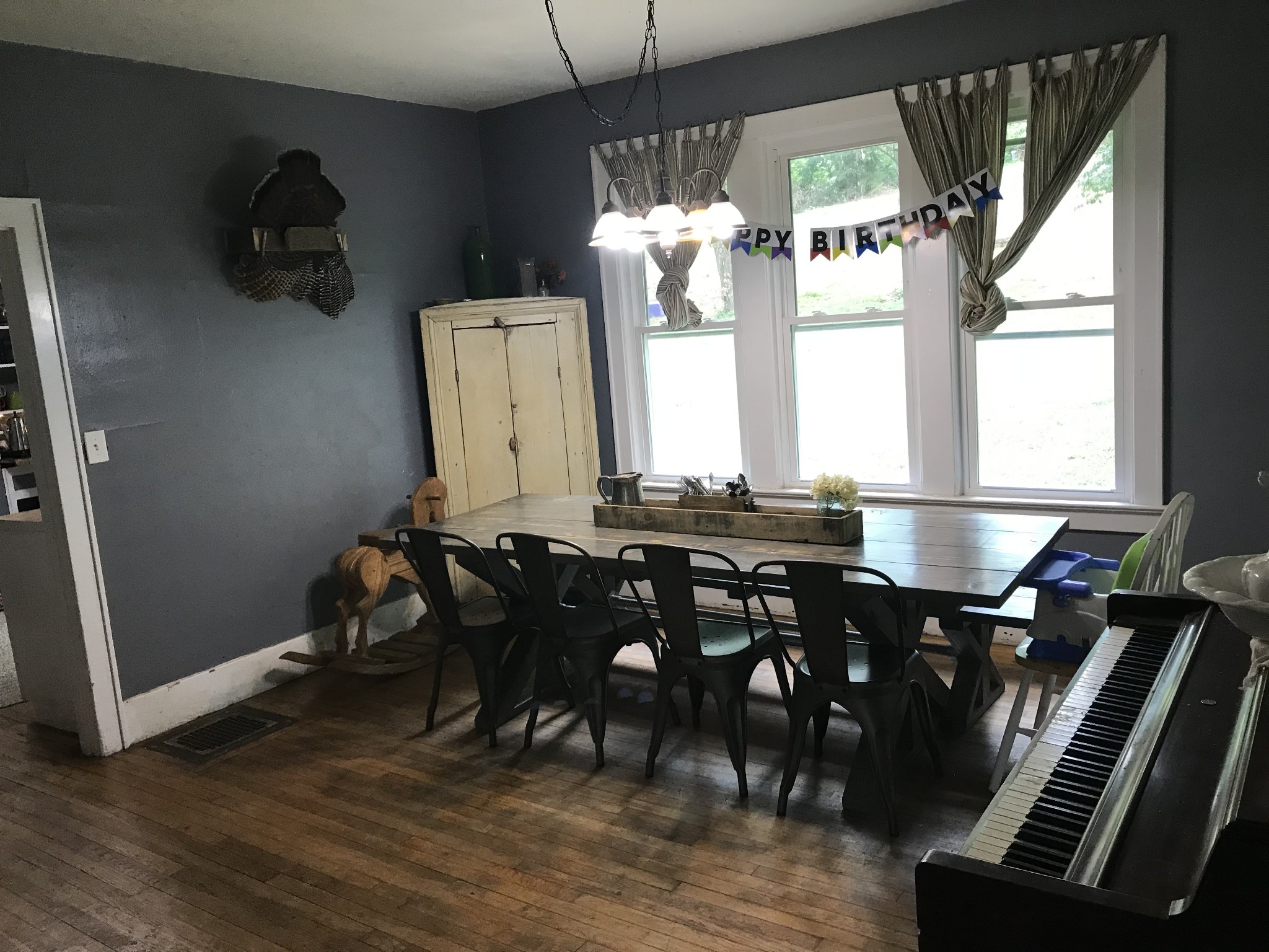 2850 Henry Gower Road Pleasant View, TN 37146 - Photo 9 of 22 a dining room with wooden floor a glass table and chairs