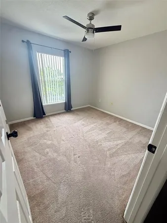 a view of an empty room with a window