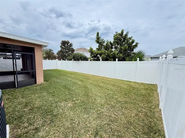 a view of an outdoor space and backyard of house