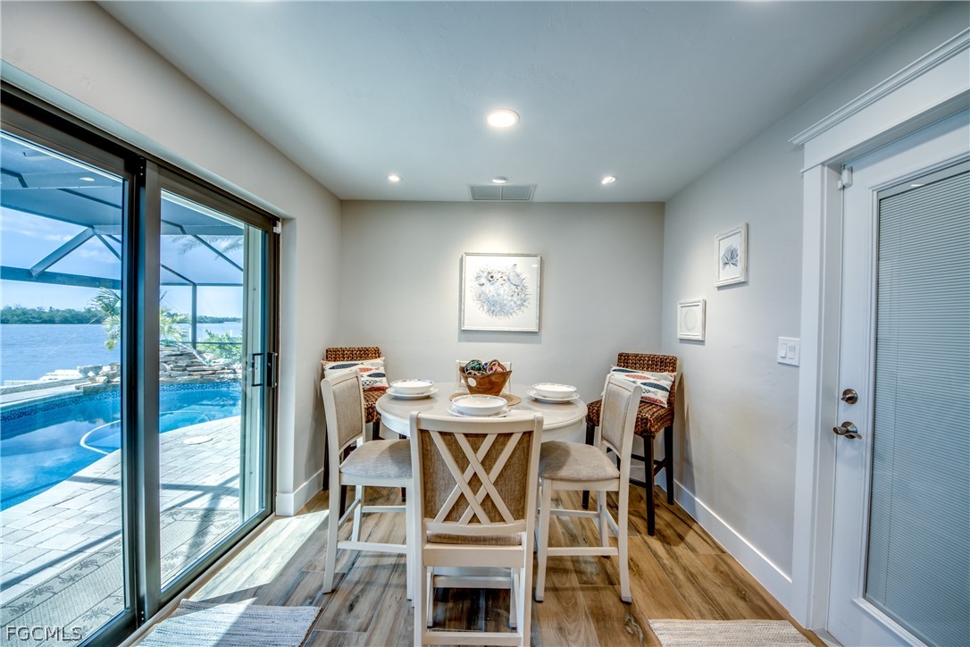 11599 Island Avenue Matlacha, FL 33993 - Photo 12 of 38 a view of a dining room with furniture window and outside view