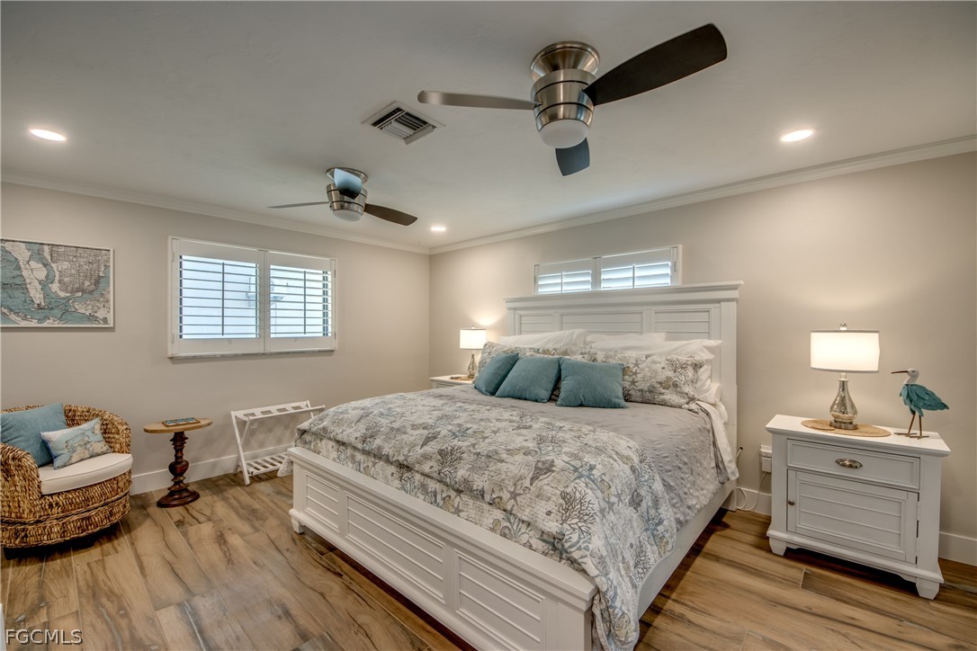 11599 Island Avenue Matlacha, FL 33993 - Photo 18 of 38 a bedroom with a bed and furniture