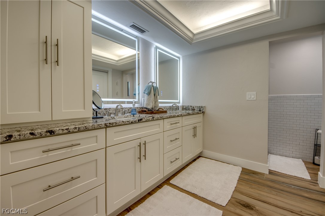 11599 Island Avenue Matlacha, FL 33993 - Photo 20 of 38 a bathroom with a sink and a mirror