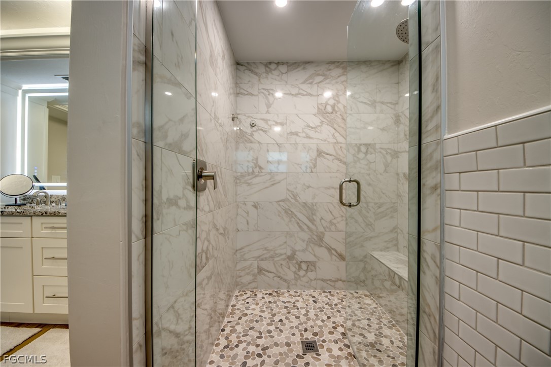 11599 Island Avenue Matlacha, FL 33993 - Photo 21 of 38 a bathroom with a shower
