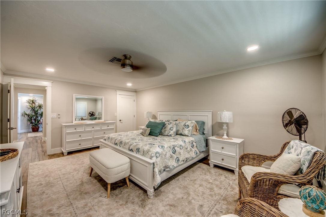 11599 Island Avenue Matlacha, FL 33993 - Photo 23 of 38 a bedroom with a bed and furniture