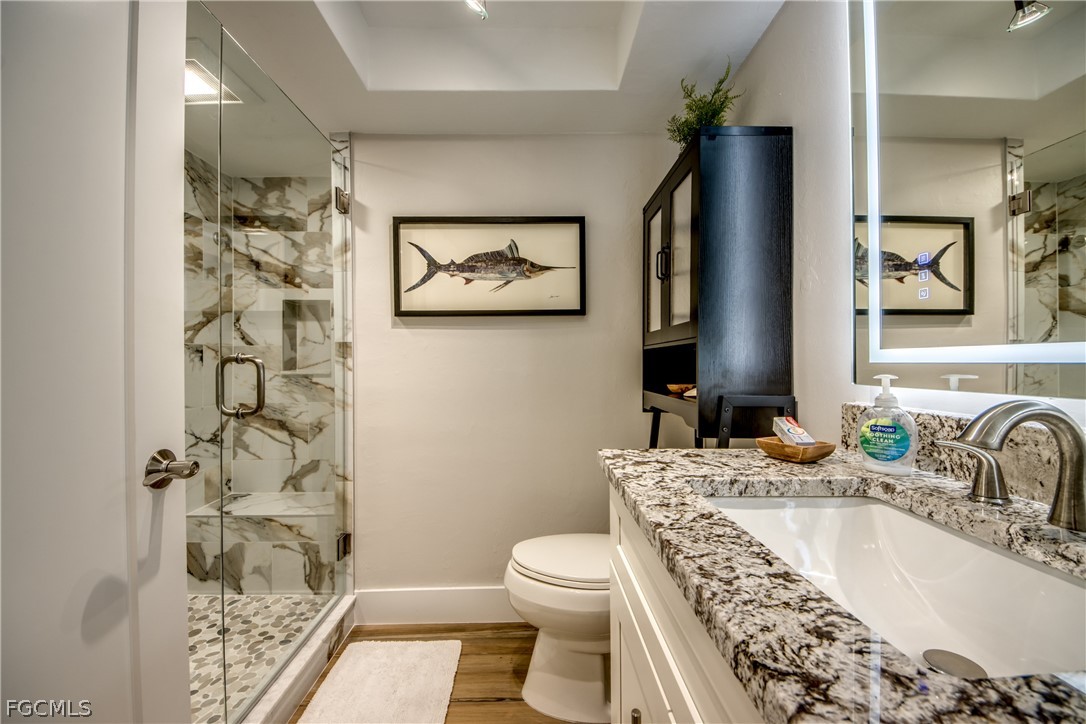 11599 Island Avenue Matlacha, FL 33993 - Photo 25 of 38 a bathroom with a sink a toilet and shower